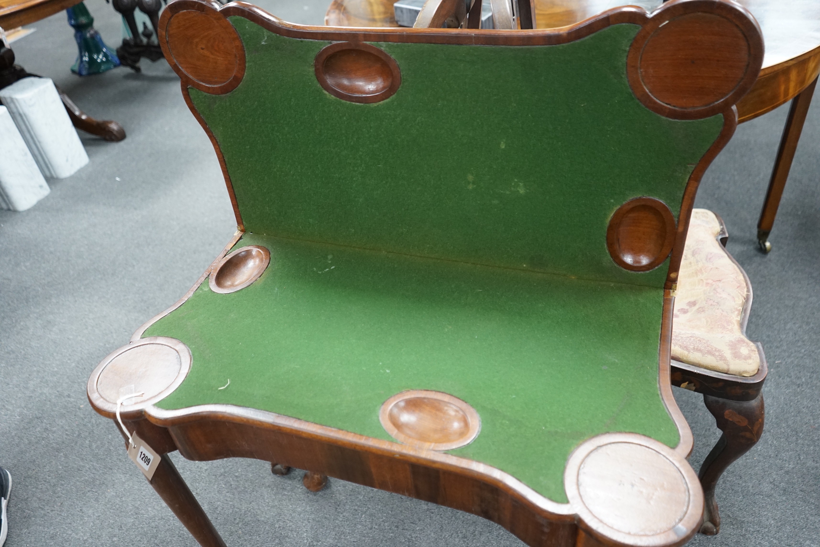 A George III mahogany concertina action folding games table, width 79cm, depth 40cm, height 72cm